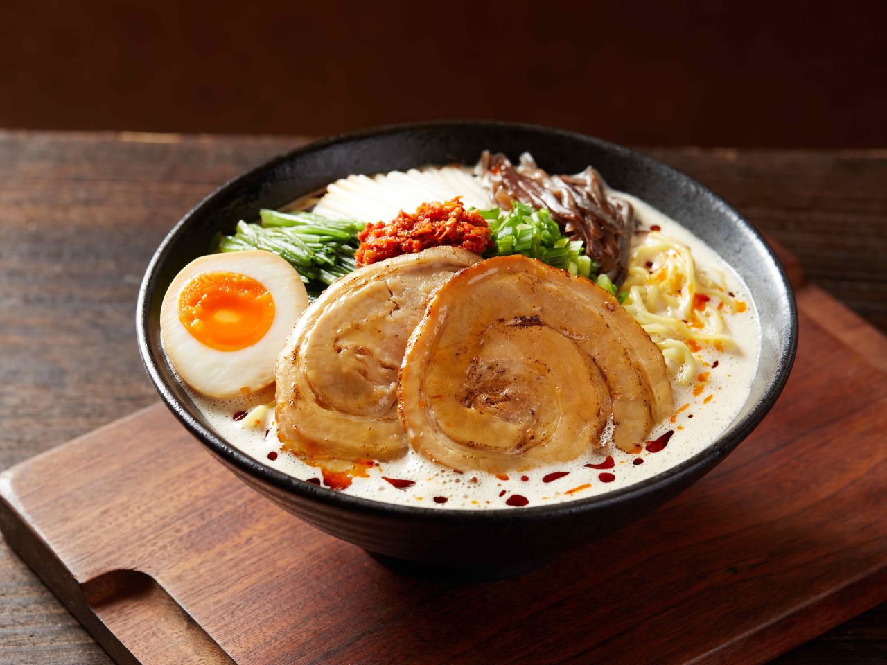 Spicy creamy tonkotsu ramen with foam at Tosakko Ramen & Yakitori, a Japanese Restaurant in Pasadena