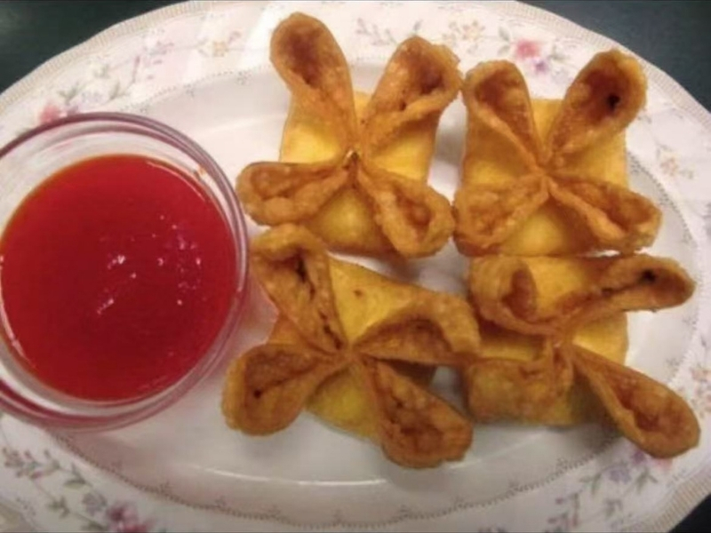 Fried dumplings in flower - like shape, served with red dipping sauce at Town East Asian Buffet, a Self service restaurant in Mesquite