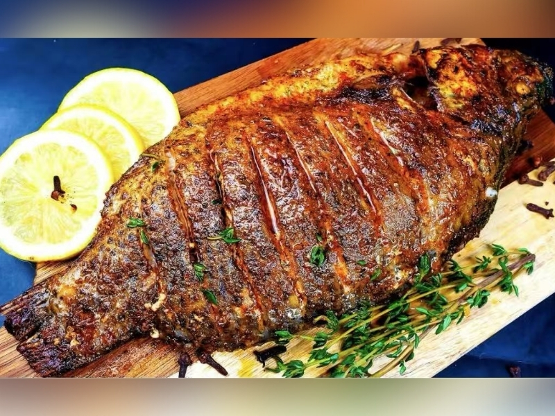 Grilled fish garnished with lemon slices and thyme at Town East Asian Buffet, a Self service restaurant in Mesquite