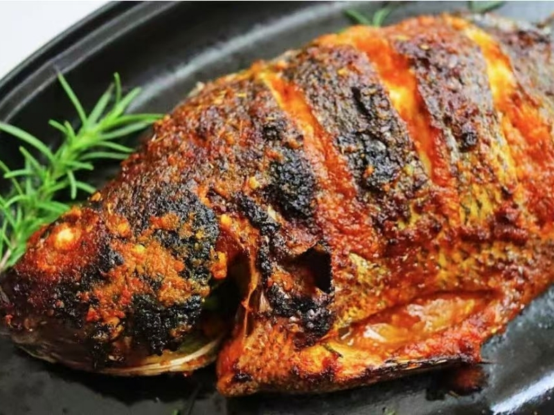 Grilled fish seasoned well, garnished with rosemary at Town East Asian Buffet, a Self service restaurant in Mesquite