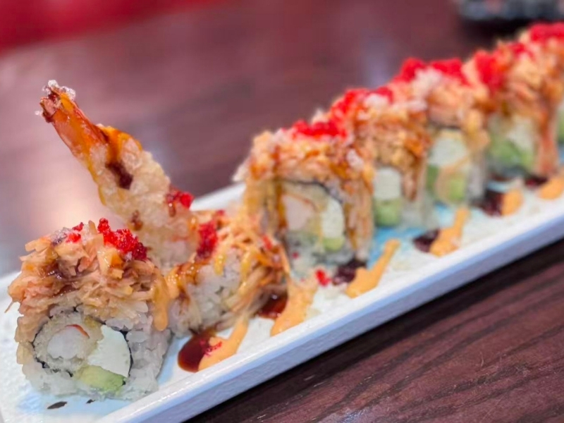 Sushi roll with tempura shrimp, crab, avocado, and toppings at Tsukiyo Sushi Restaurant, a Sushi Restaurant in Smithtown