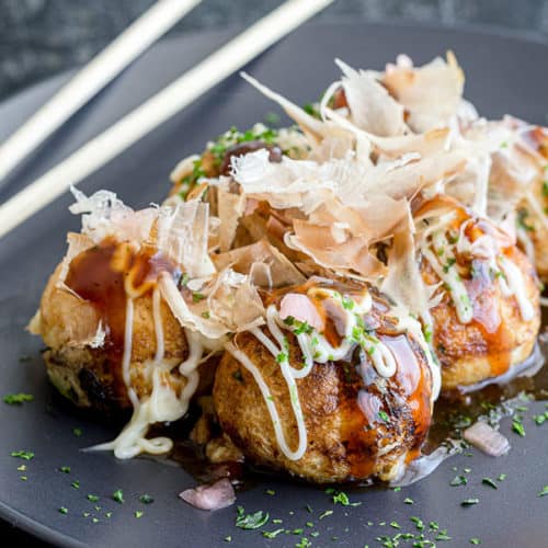 Takoyaki with bonito flakes and creamy sauce at Tsunami Japanese Restaurant in Burnsville