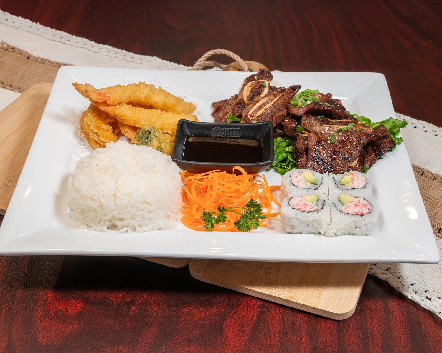 Combination dinner plate with short rib, tempura shrimp, rice and fresh sushi maki at Ubin Sushi, a Japanese restaurant in Colorado Springs