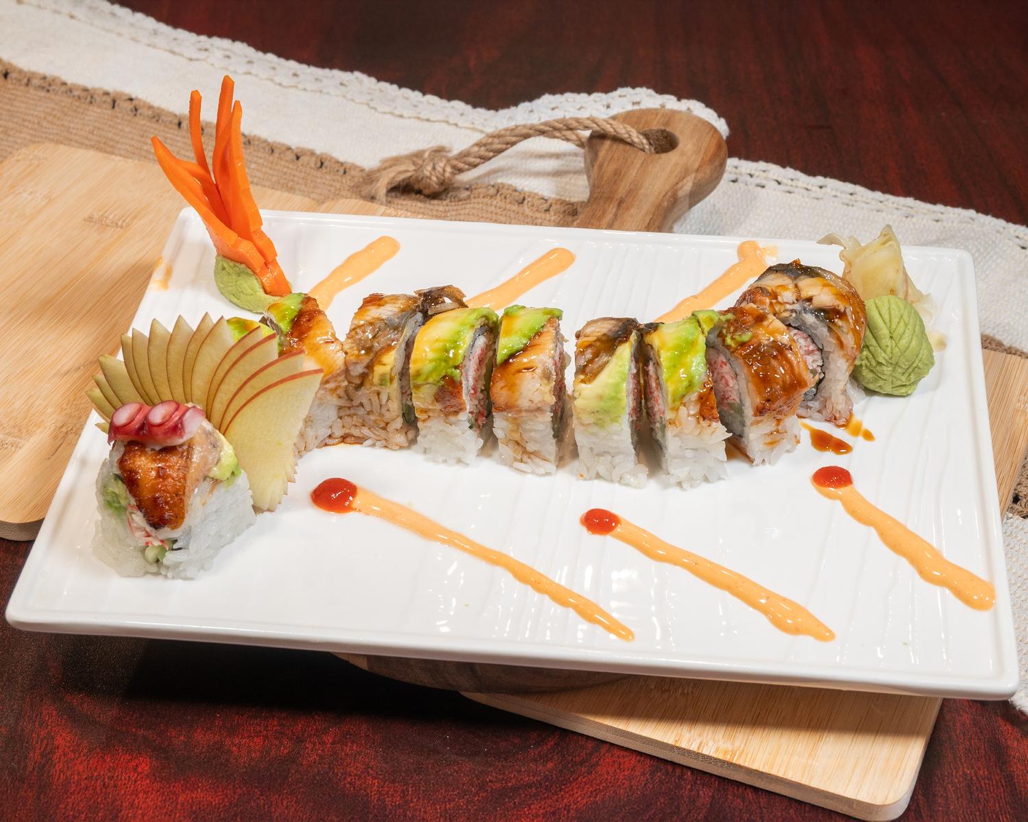 Eel avocado sushi roll garnished with fruit, wasabi and decorative spicy sauce drizzle at Ubin Sushi, a Japanese restaurant in Colorado Springs