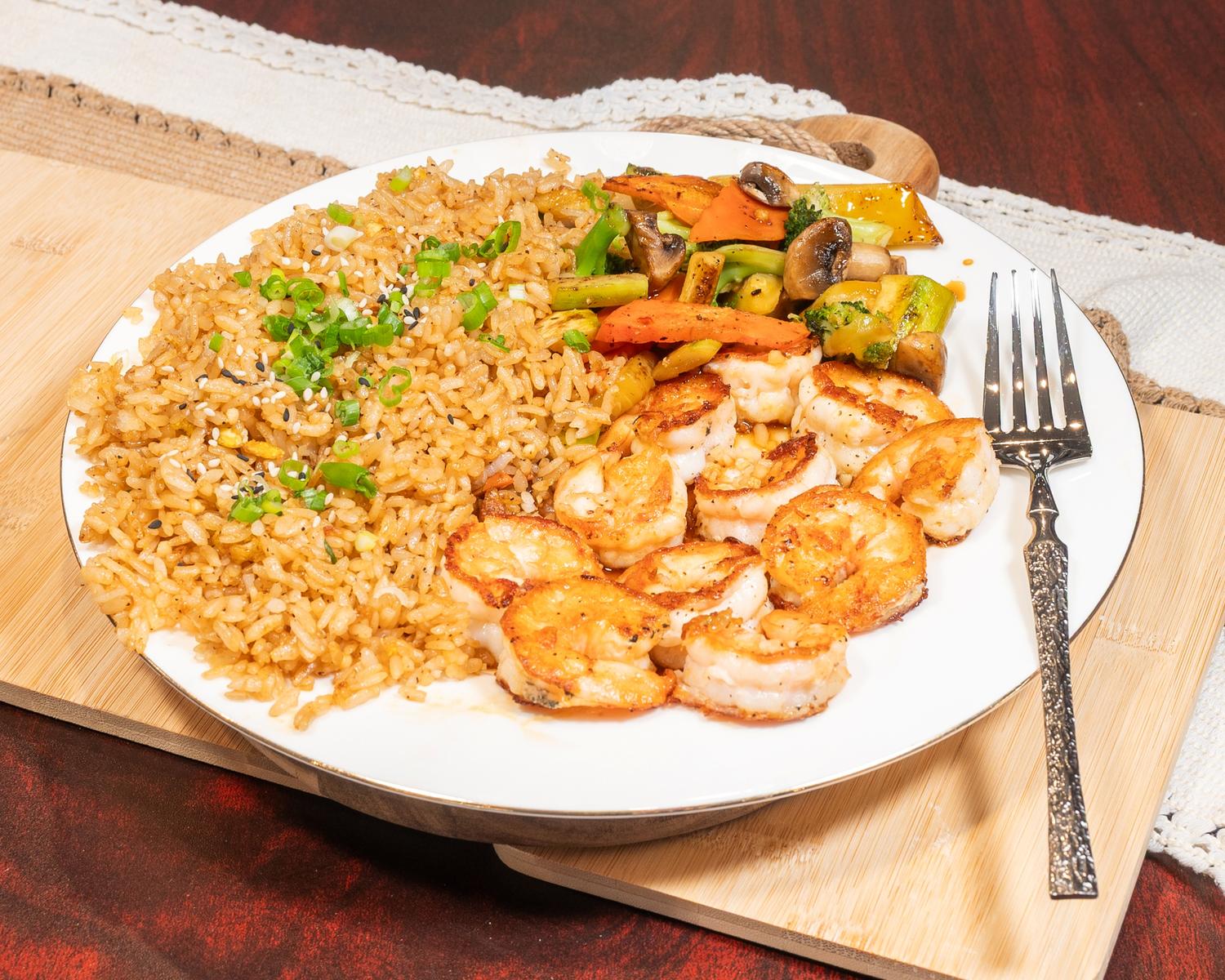 Savory shrimp fried rice with mixed roasted veggies, green onion and toasted sesame seeds at Ubin Sushi, a Japanese restaurant in Colorado Springs