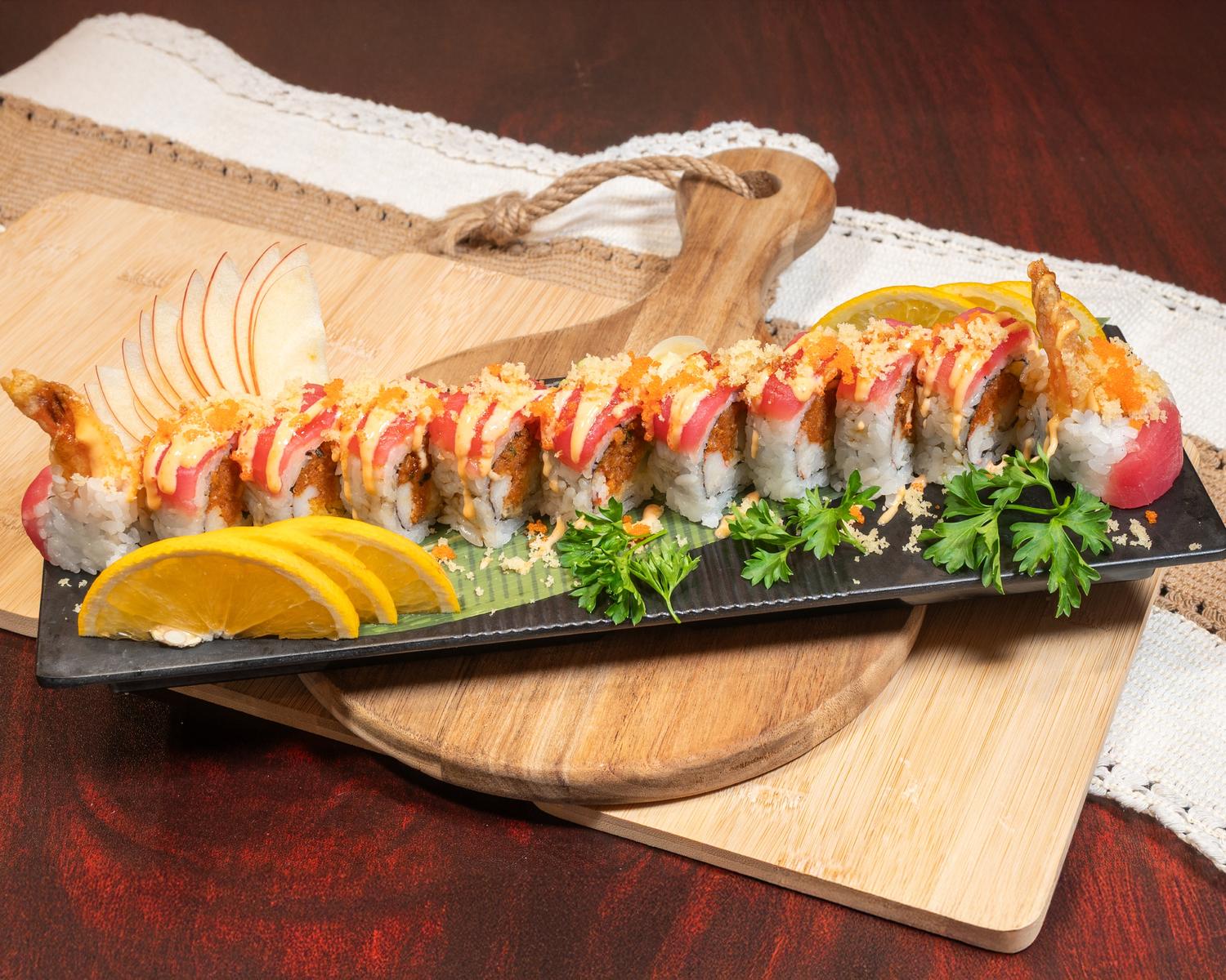 Tuna specialty sushi roll topped with crunchy bits, spicy sauce and fresh citrus garnish at Ubin Sushi, a Japanese restaurant in Colorado Springs