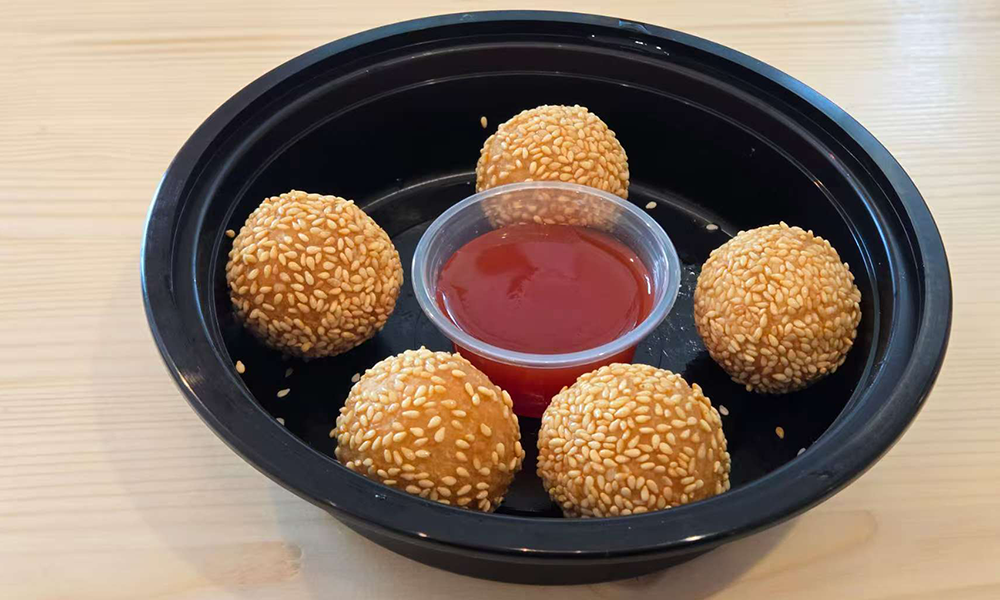 Sesame-coated sweet balls with red sauce at U Bowl, a Asian Restaurant in Winston-Salem