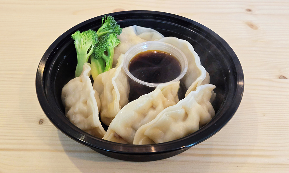 Soft steamed pork dumplings with soy sauce at U Bowl, a Asian Restaurant in Winston-Salem