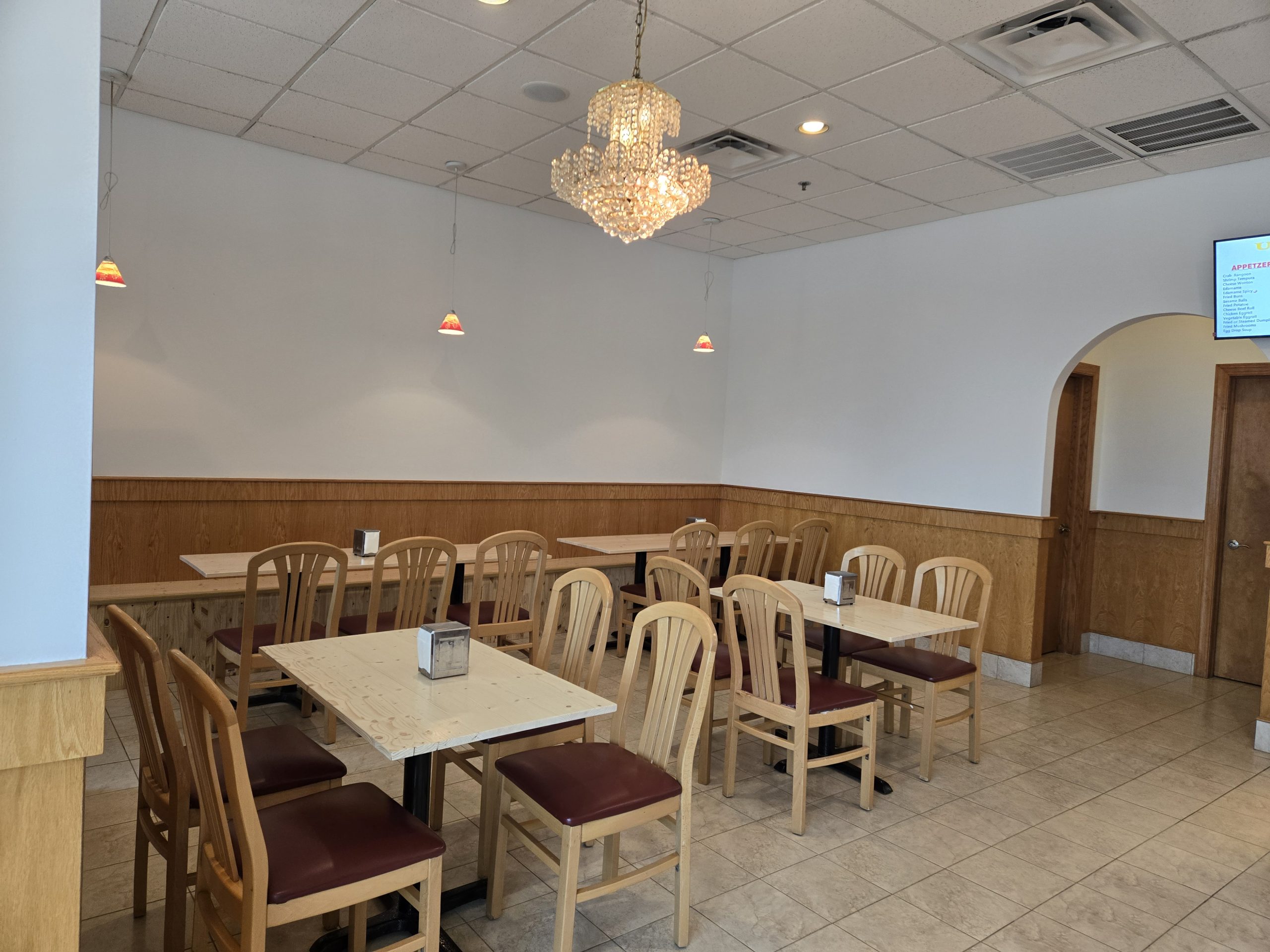 Cozy dining space with tables & chandelier at U Bowl, a Asian Restaurant in Winston-Salem