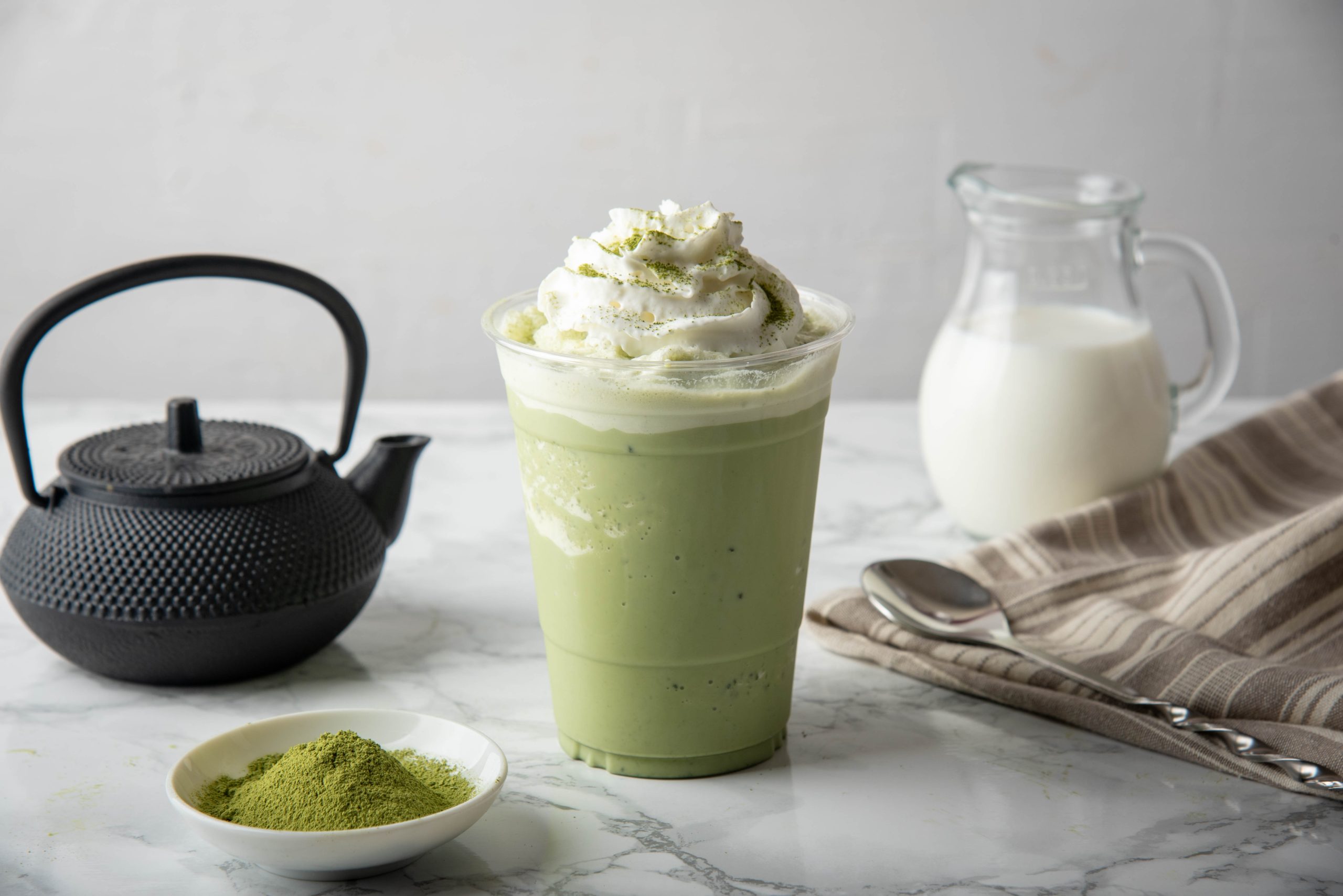 Creamy matcha milkshake topped with whipped cream at U Coco Tea, a Bubble Tea Shop in Sacramento