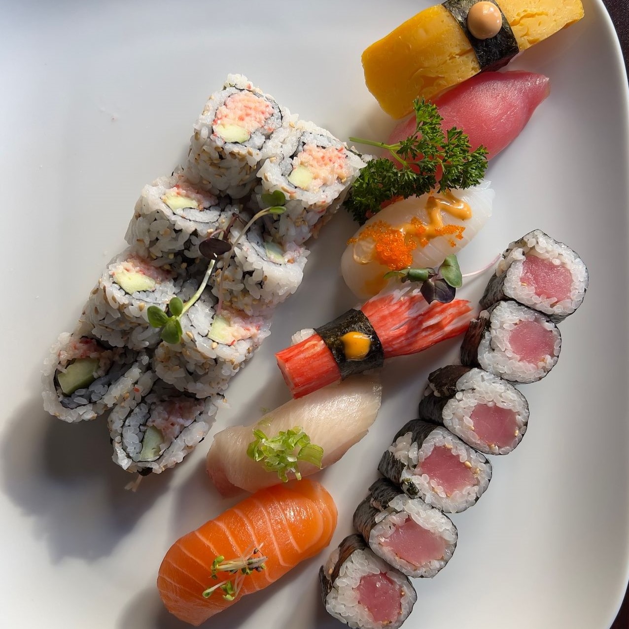 Assorted sushi plate with nigiri, tuna maki and crab salad rolls at Umami Sushi & Chinese Cuisine, an Asian Fusion Restaurant in Minneapolis