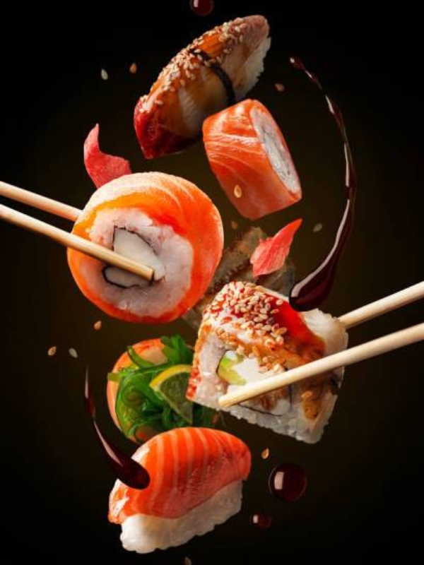 Premium sushi pieces floating with soy sauce drizzle at Umami Sushi Pdx Food Cart, a Japanese Restaurant in Portland