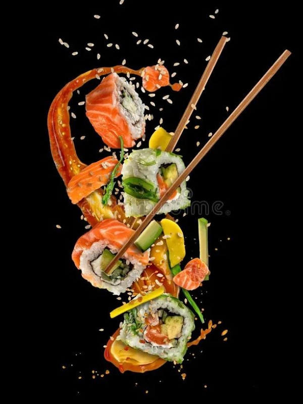 Vibrant salmon sushi rolls flying with spicy sauce at Umami Sushi Pdx Food Cart, a Japanese Restaurant in Portland