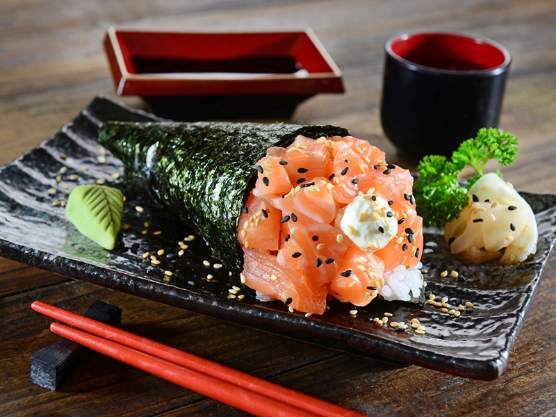 Crispy temaki sushi filled with fresh salmon and creamy sauce at Ume Poke, a Asian Fusion Restaurant in Jacksonville