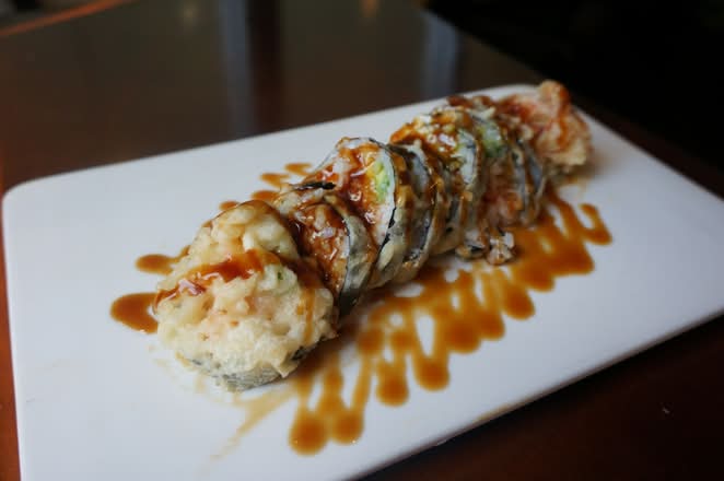 Crispy shrimp roll drizzled with sauce at Umi Japanese Cuisine, a Japanese Restaurant in Washington