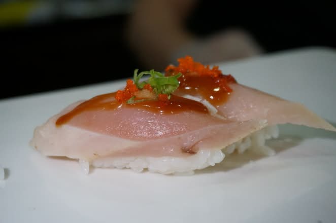 Light tuna nigiri with sauce and tobiko at Umi Japanese Cuisine, a Japanese Restaurant in Washington