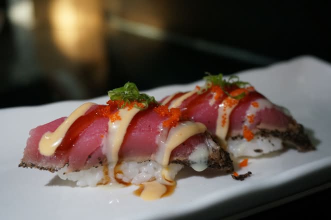 Seared tuna nigiri with sauce and tobiko at Umi Japanese Cuisine, a Japanese Restaurant in Washington