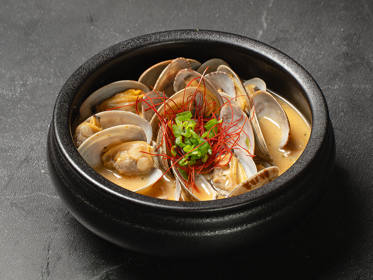 Butter miso clams topped with green onions