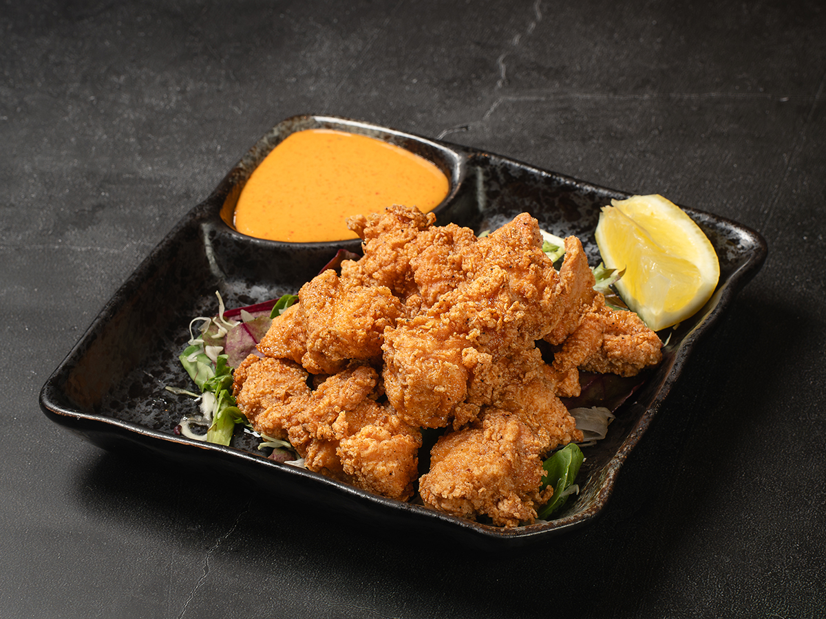 Crispy chicken karaage with dipping sauce and lemon