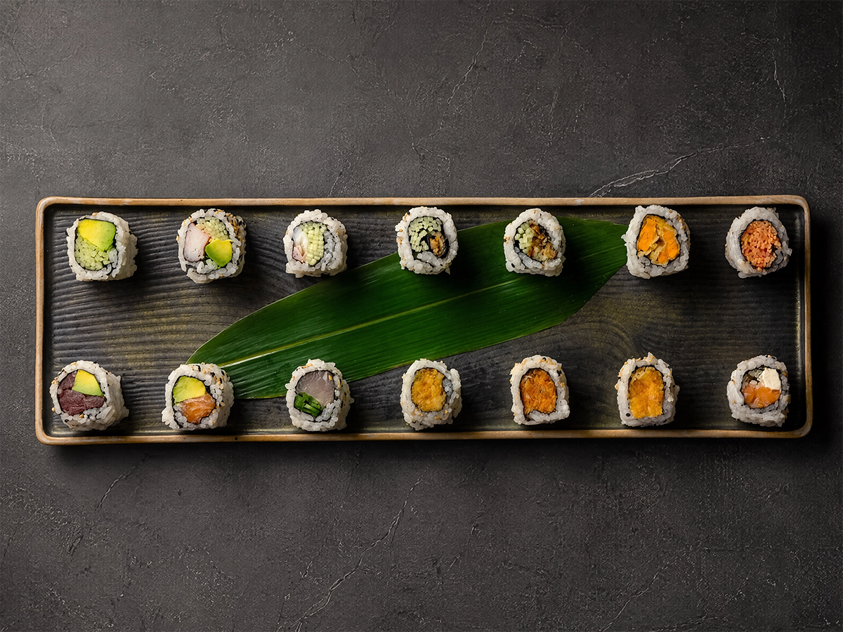 Assorted maki sushi rolls on a serving platter