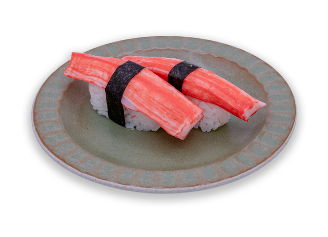 Kanikama nigiri with imitation crab over sushi rice