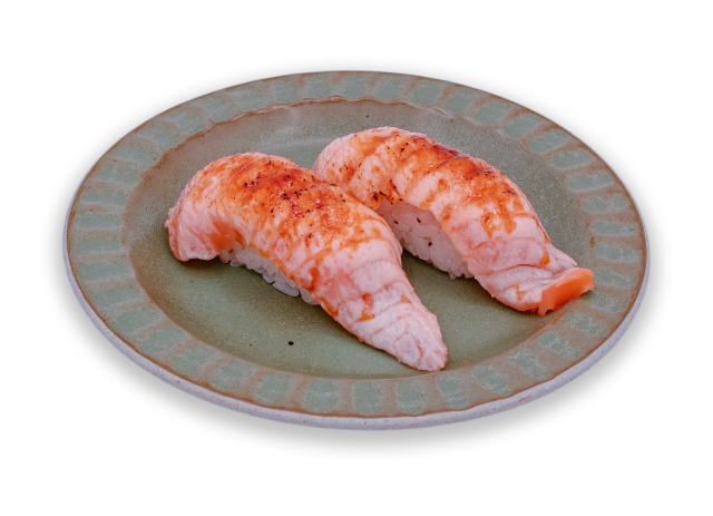 Salmon and caramelized nigiri served on a ceramic plate