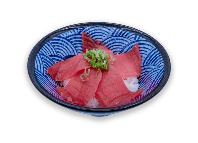 Fresh tuna slices over rice with green onions