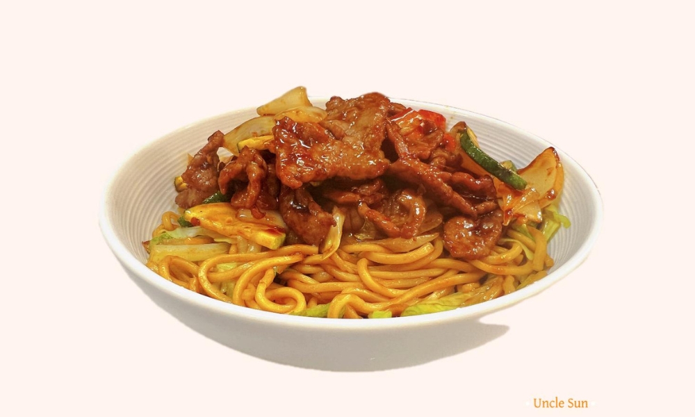 Beef and vegetable stir-fry over noodles at Uncle Sun, a Chinese Restaurant in Eugene