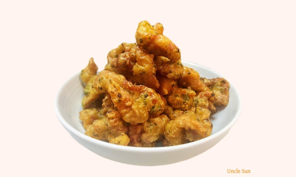 Crispy fried chicken bites with seasoning in a bowl at Uncle Sun, a Chinese Restaurant in Eugene