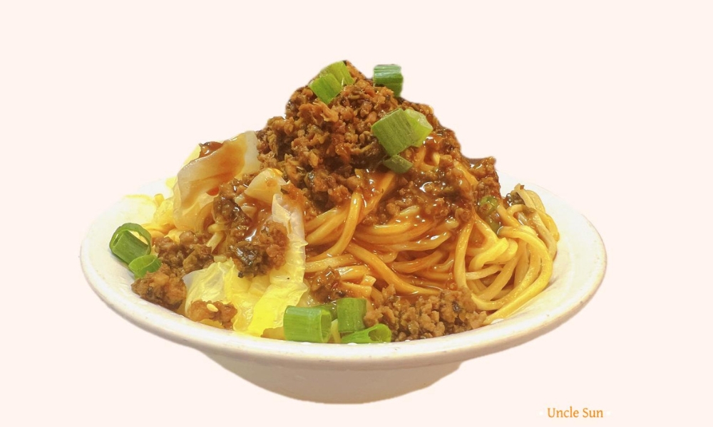 Noodles topped with savory mince meat and cabbage at Uncle Sun, a Chinese Restaurant in Eugene