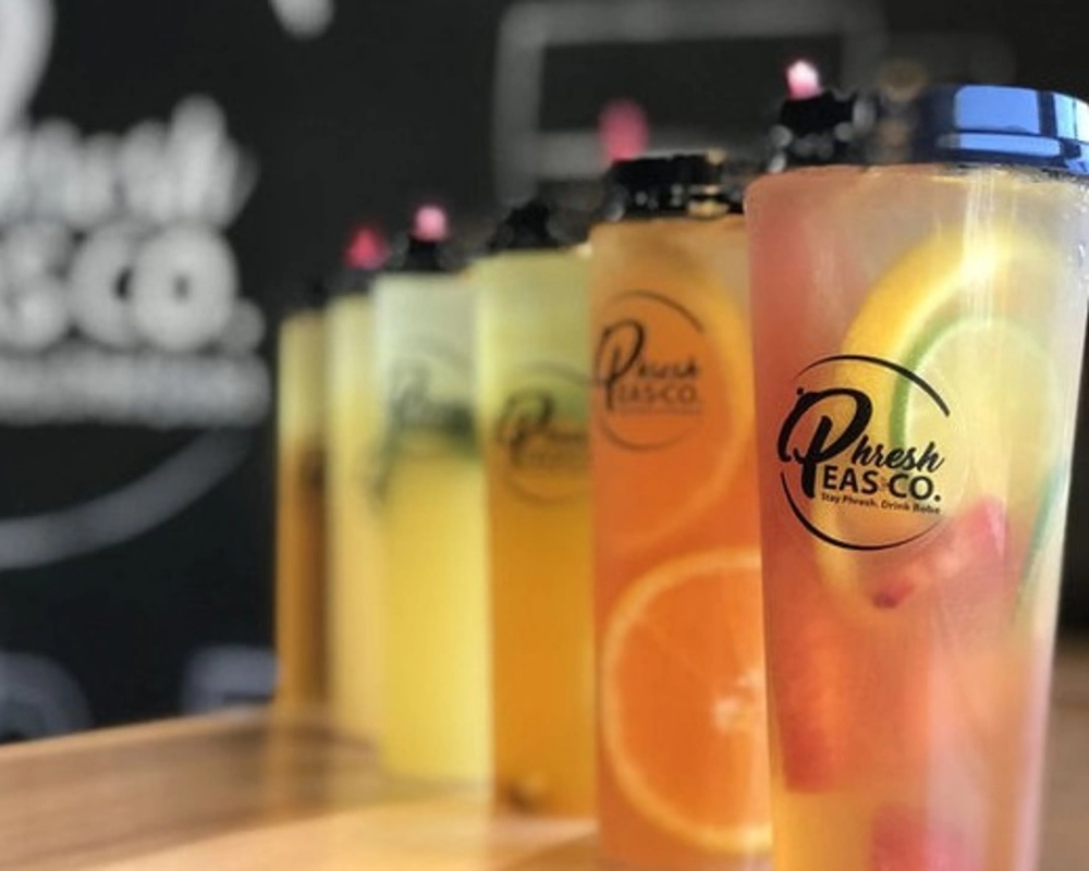 Assorted fresh fruit teas in vibrant colors at Uniboil Phresh Teas Co, a Hot Pot Restaurant in Goleta.