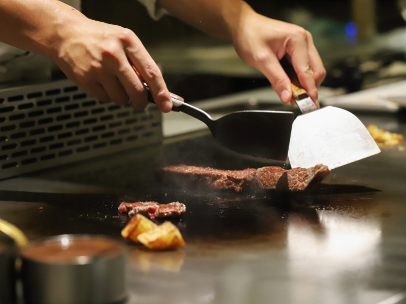 Chef cooking hibachi steak at U Sushi & Hibachi, a Japanese Restaurant in Ormond Beach