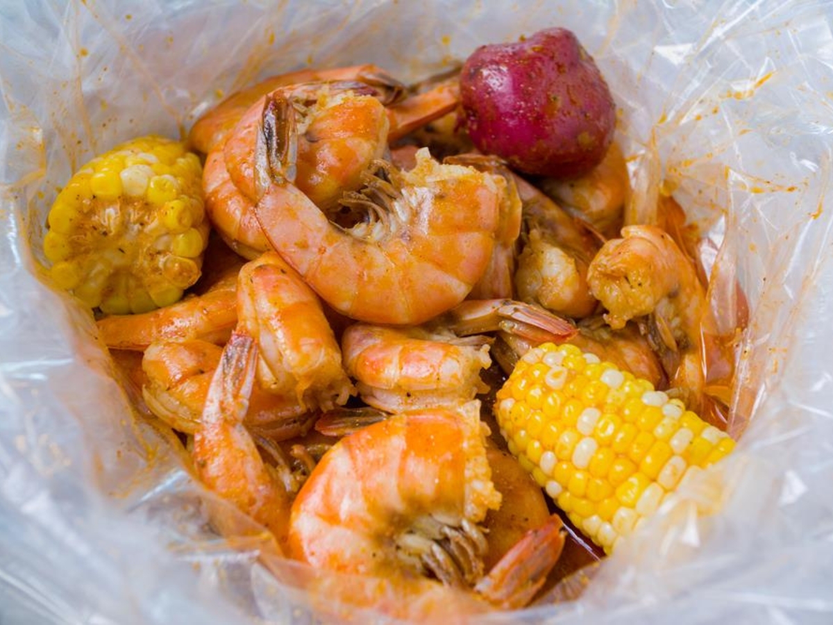 Spicy boiled shrimp with corn and potato at Utica Crab & Boil, a Seafood Restaurant in Utica