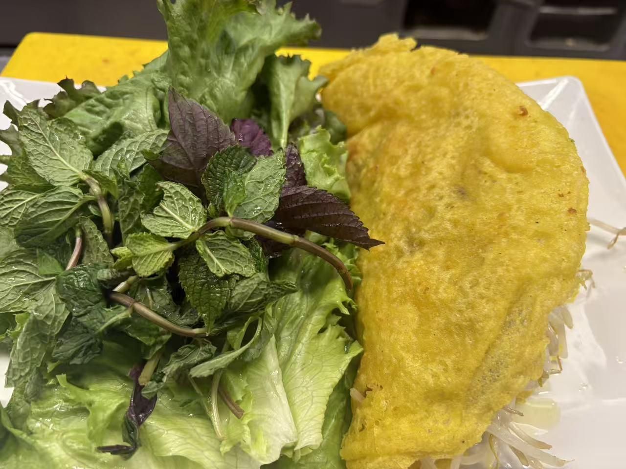 Vietnamese savory pancake with fresh herbs at Viet Quan Vietnamese Noodle House, a Vietnamese Restaurant in San Francisco