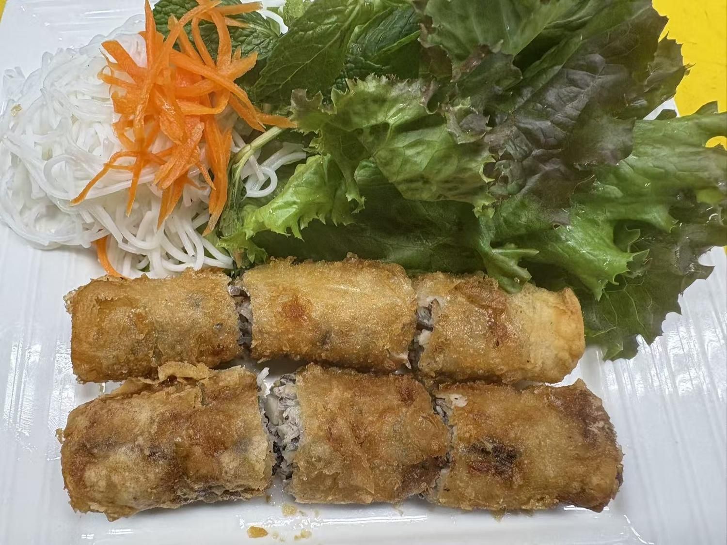 Crispy fried spring rolls with rice noodles and herbs at Viet Quan Vietnamese Noodle House, a Vietnamese Restaurant in San Francisco