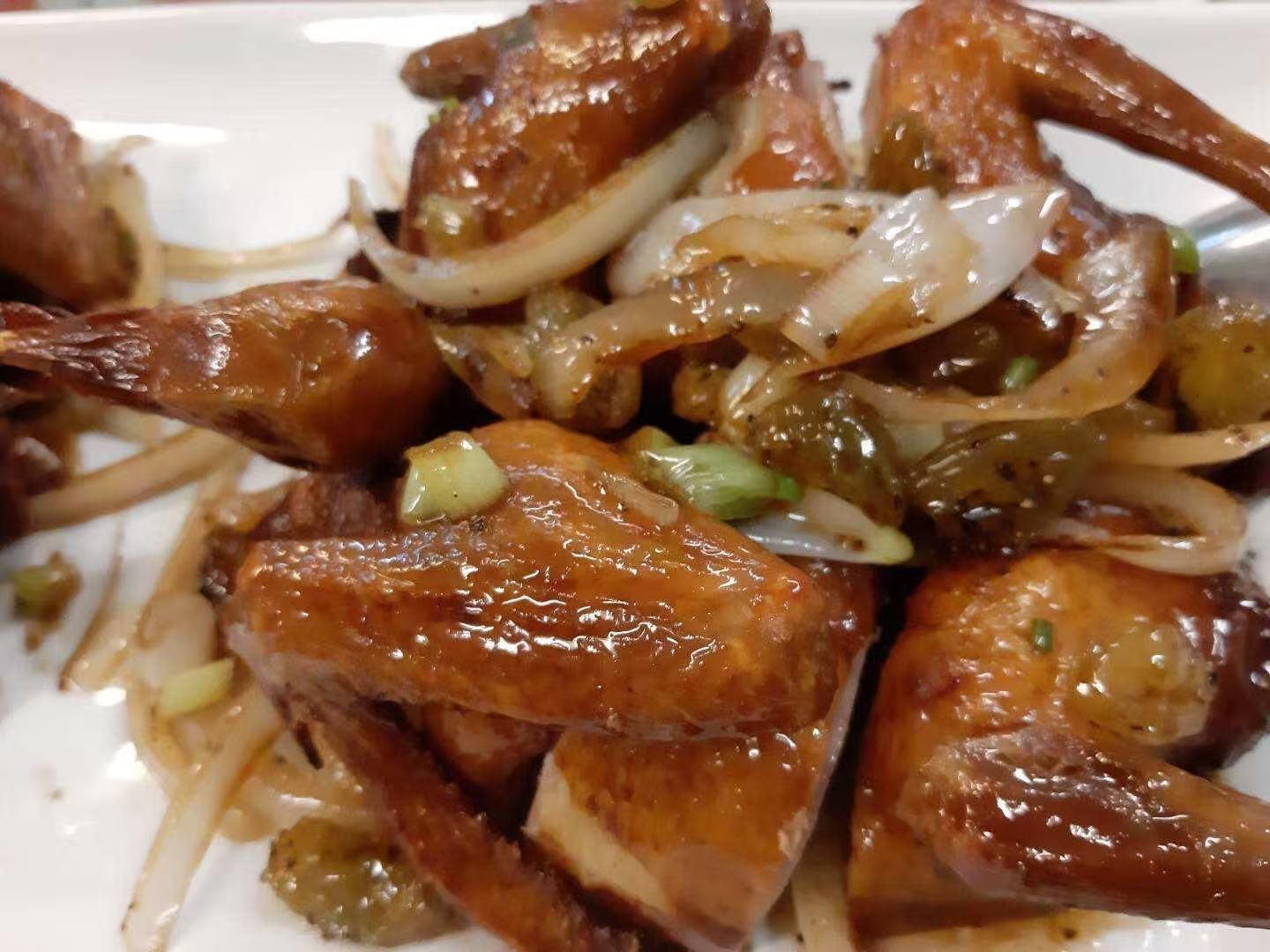 Braised pigeon with onions in savory sauce at Viet Quan Vietnamese Noodle House, a Vietnamese Restaurant in San Francisco