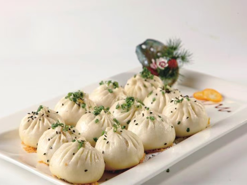 Pan-fried pork buns with crispy crust & juicy filling at Village Bao 又一村包子，a Chinese Restaurant in Sugar Land
