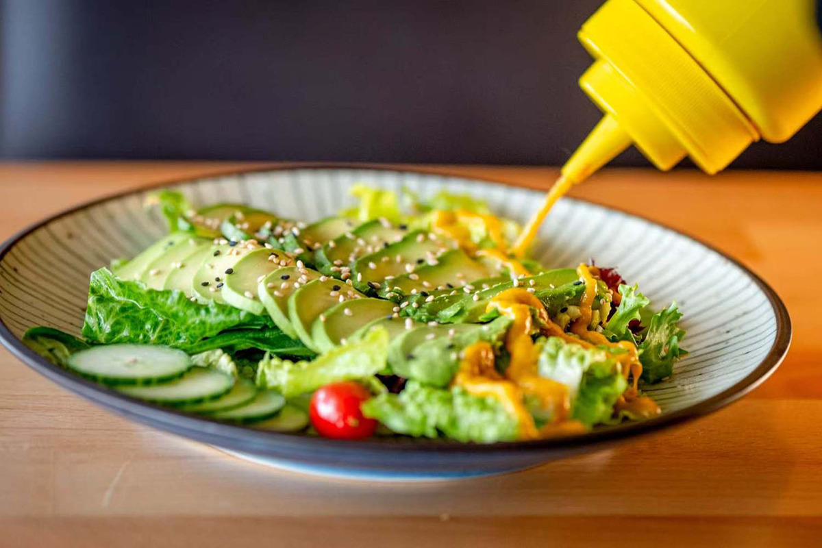 Avocado salad with cucumber lettuce and sesame at Wabi Wok & Ramen, an Asian Restaurant in Milford