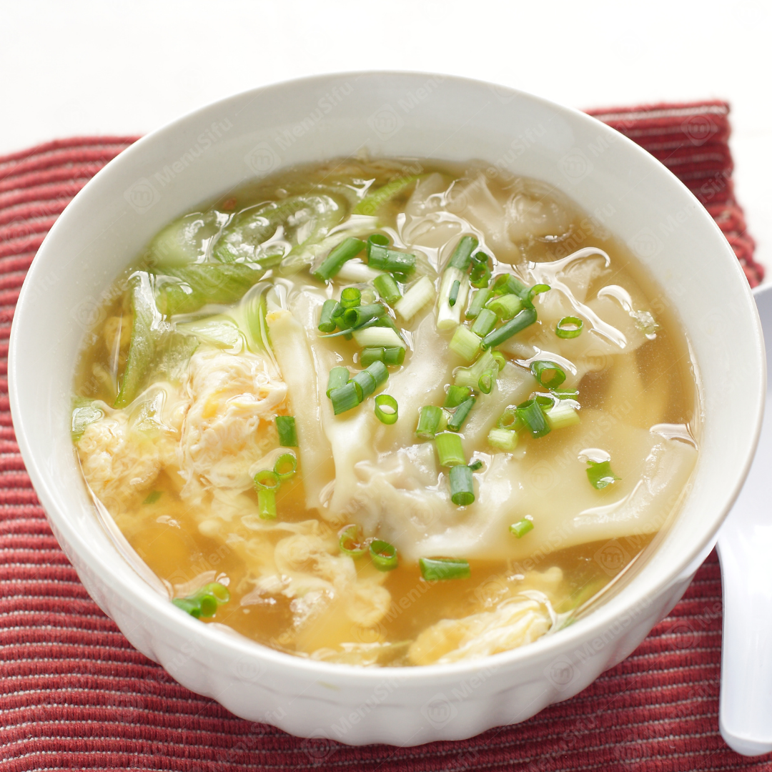Wonton Egg Soup consists of delicate wontons and fluffy egg flowers in a clear broth, garnished with scallions, creating a light and savory soup.