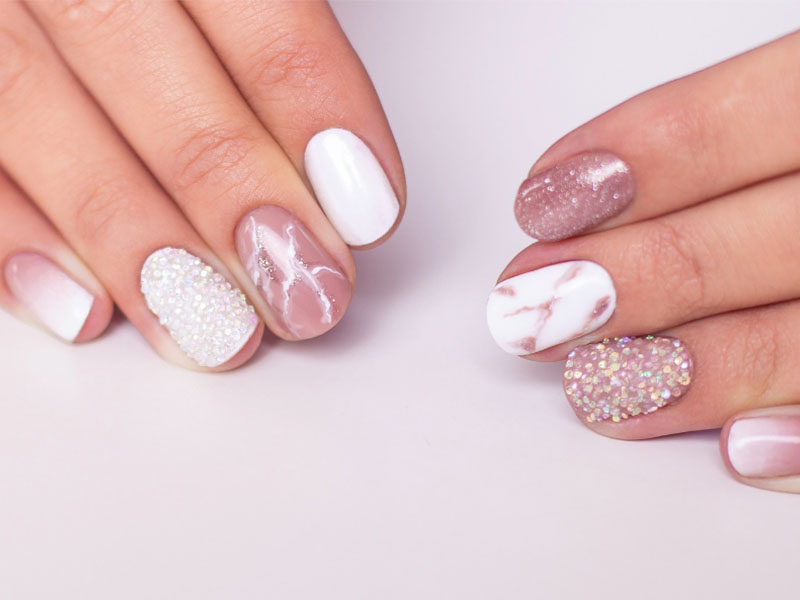 Marbled pink-white nails with glitter at Bonnie Nail Salon, a Nail Salon in Brentwood