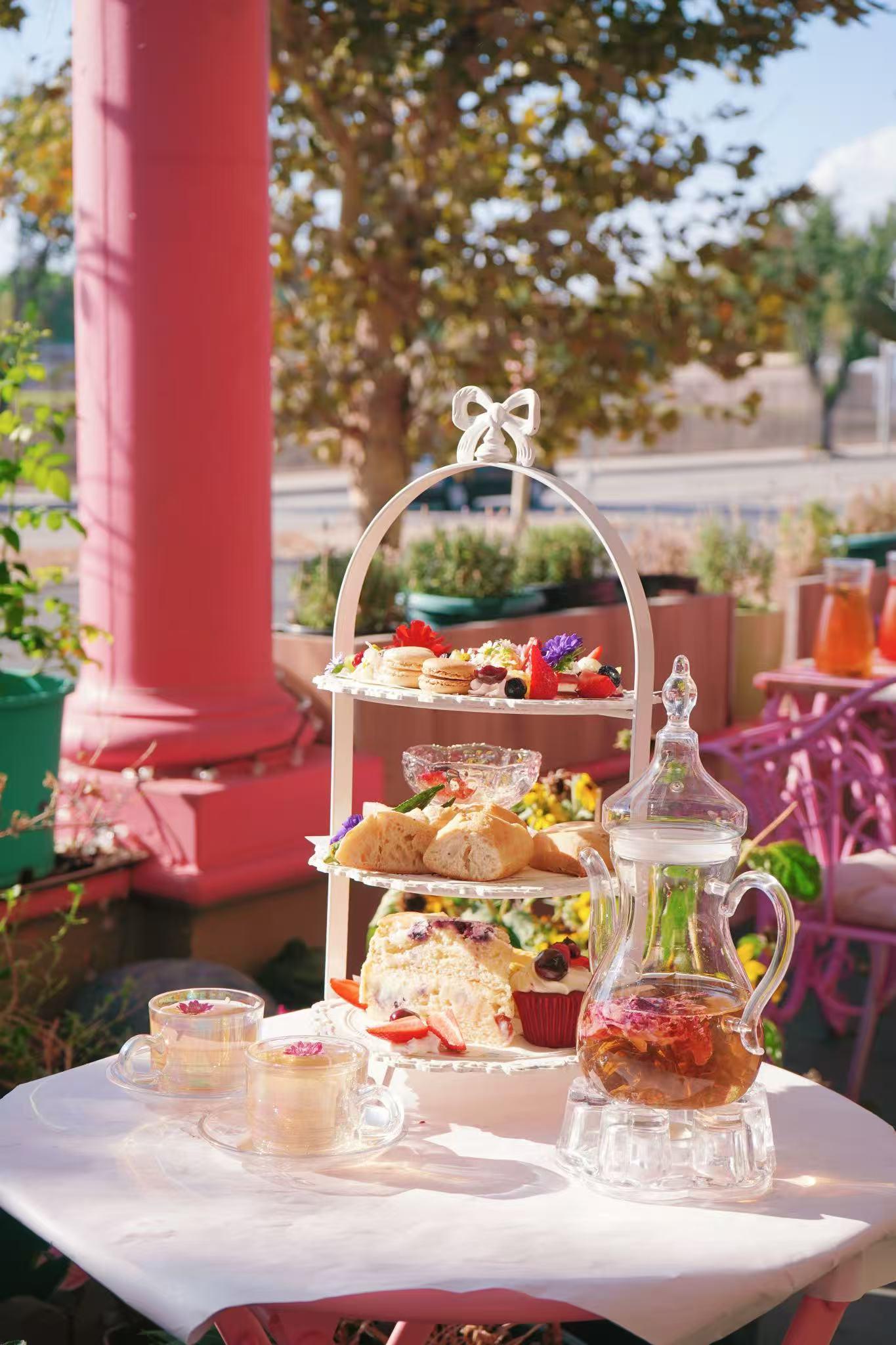 Elegant afternoon tea set with pastries and tea at Jin Foodie, a New American Restaurant in West Covina