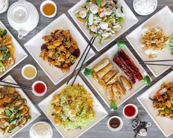 Assorted Asian dishes with tea and sauces at Wild Ginger Asian Bistro, a Asian restaurant in Gilbert