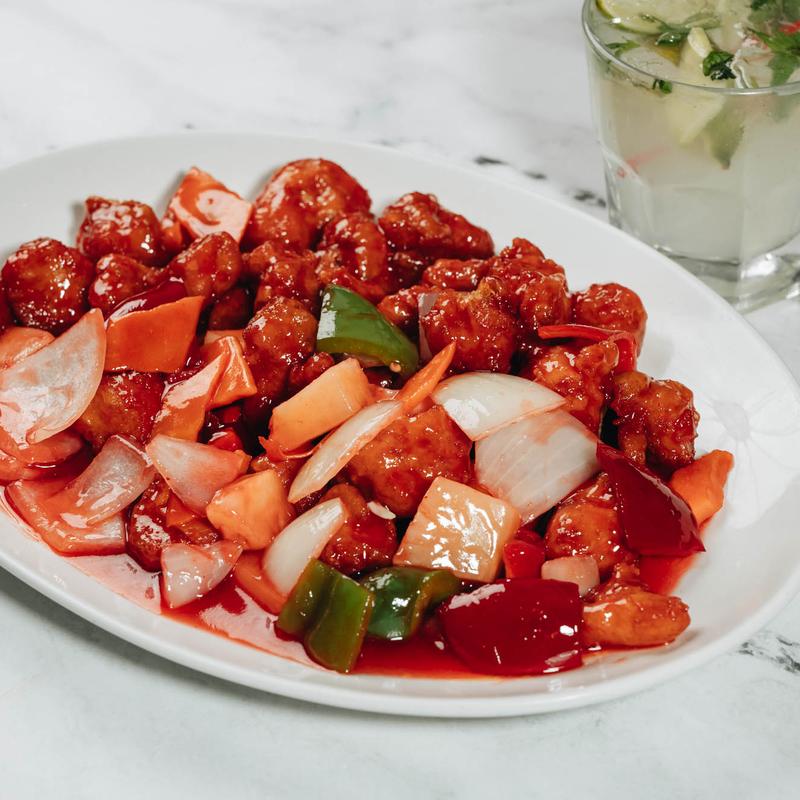 Sweet and sour chicken with bell peppers and onions