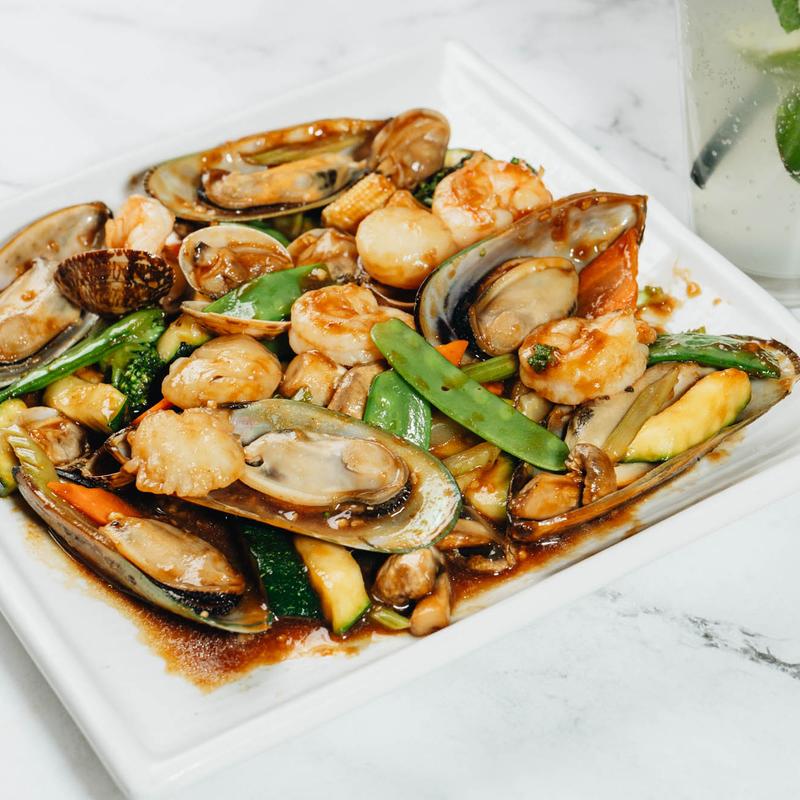 Stir-fried seafood mix with mussels, shrimp, and vegetables