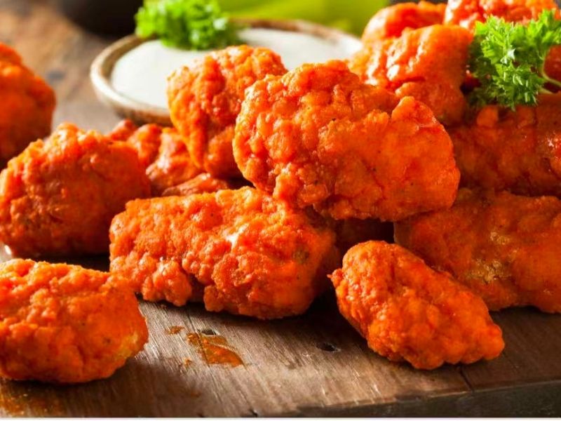 Wing-Side-Cleveland-Fast-Food-Restaurant-Buffalo-Bites-Cleveland Crispy buffalo - flavored bites, served with sauce at Wing Side - Cleveland, a Fast Food Restaurant in Cleveland