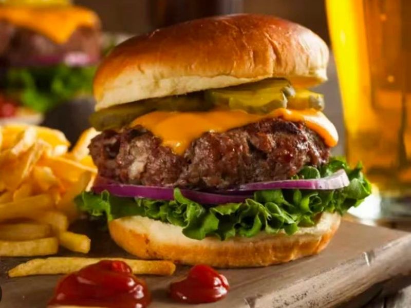 Wing-Side-Cleveland-Fast-Food-Restaurant-Cheeseburger-Cleveland Juicy burger with cheese, veggies, served with fries at Wing Side - Cleveland, a Fast Food Restaurant in Cleveland