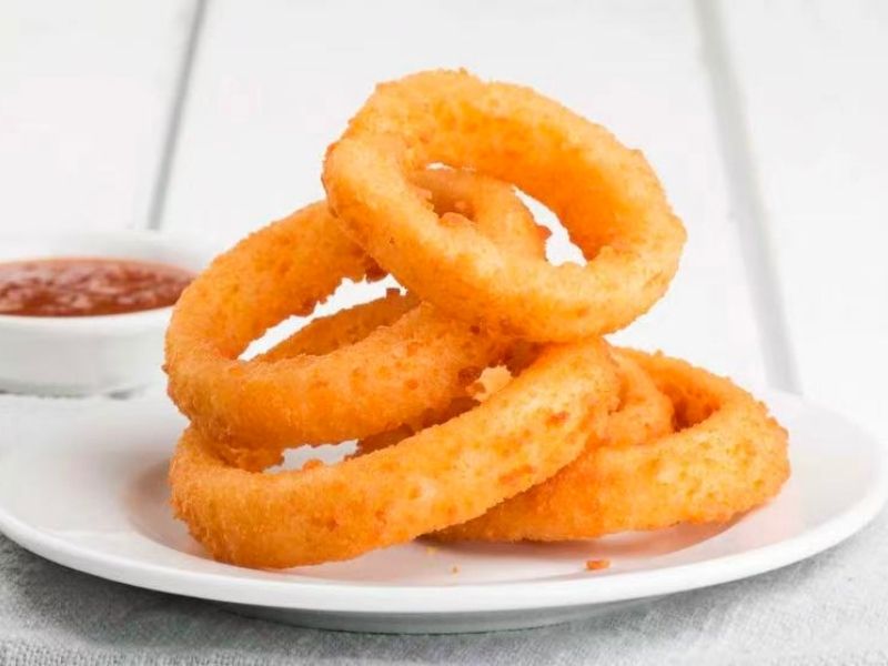 Wing-Side-Cleveland-Fast-Food-Restaurant-Onion-Rings-Cleveland Crispy deep - fried onion rings, served with sauce at Wing Side - Cleveland, a Fast Food Restaurant in Cleveland