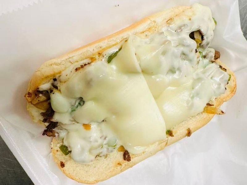 Wing-Side-Cleveland-Fast-Food-Restaurant-Philly-Cheesesteak-Cleveland Steak, peppers, onions, melted cheese in a sub at Wing Side - Cleveland, a Fast Food Restaurant in Cleveland