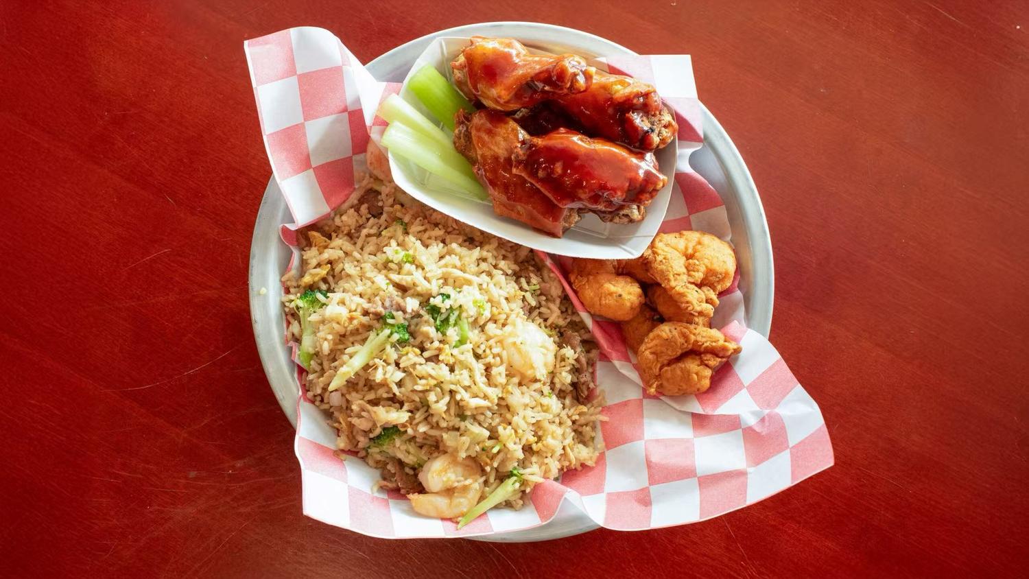 Fried chicken wings with fried rice and hush puppies from Wings Way, a chicken wing restaurant in Hollywood