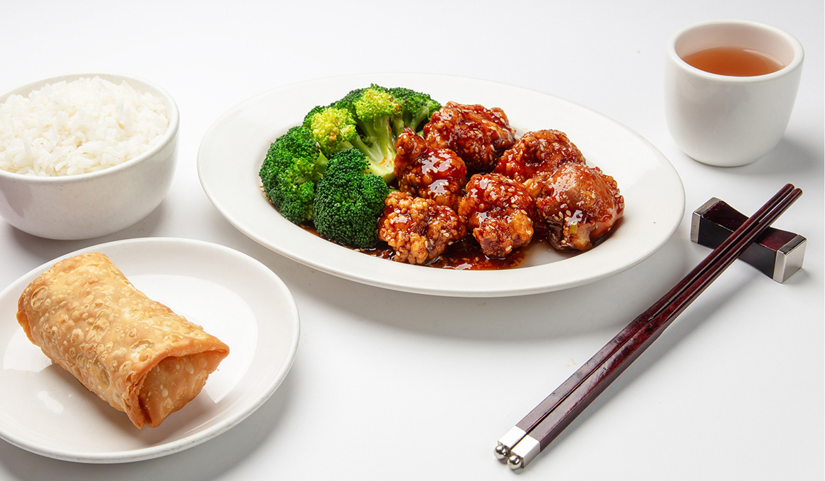 Glazed chicken with broccoli rice egg roll and tea at Wok 88, a Chinese Restaurant in New York